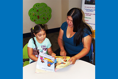 Mom reading to daughter