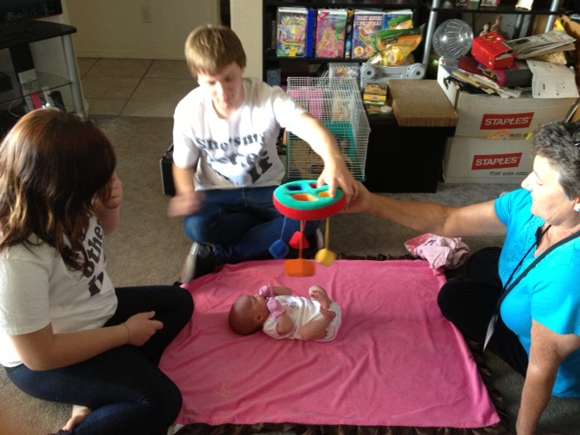 people-playing-with-baby