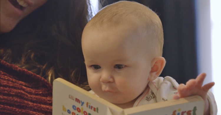 Baby reading a book