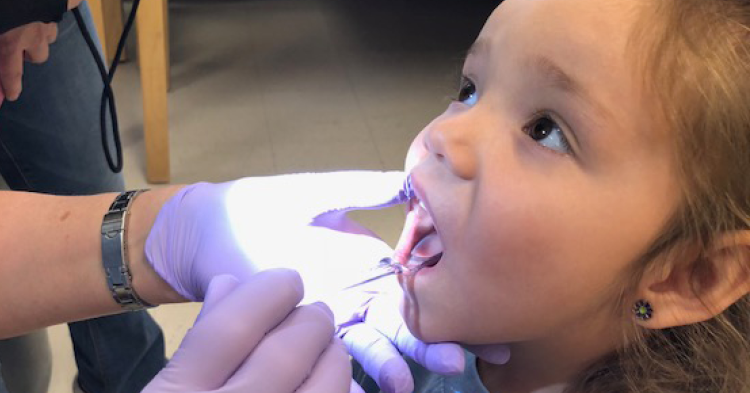 little girl dental exam
