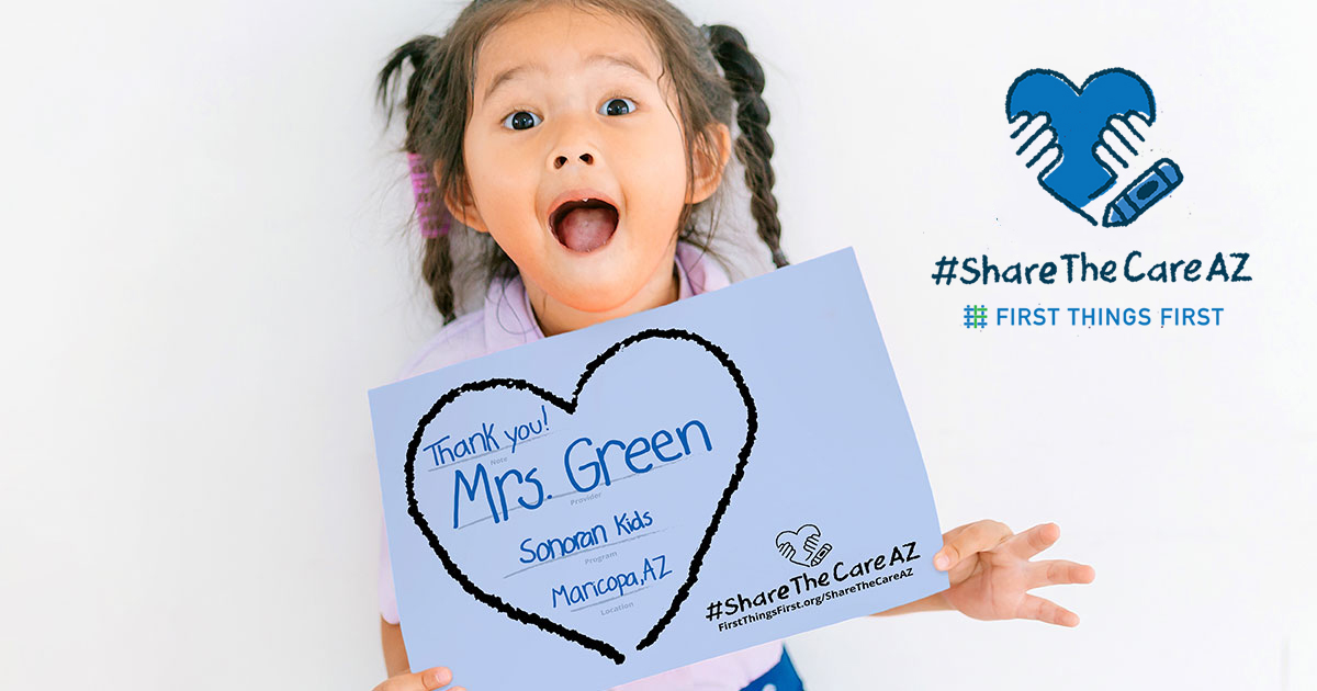 little girl holding share the care sign