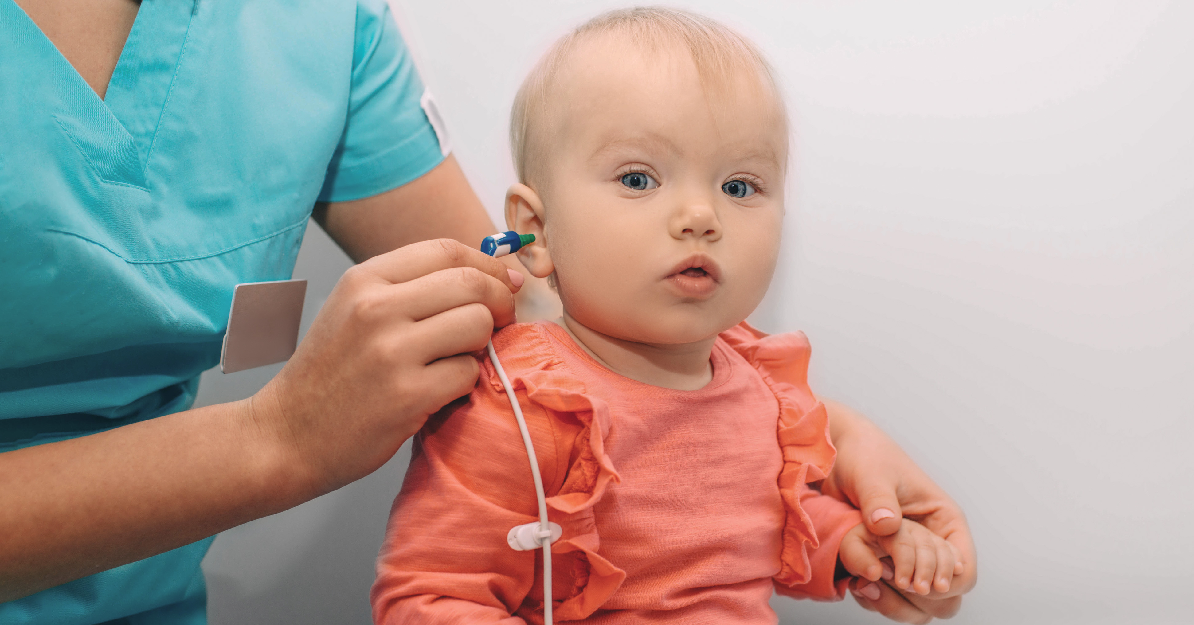 baby girl getting hearing screened