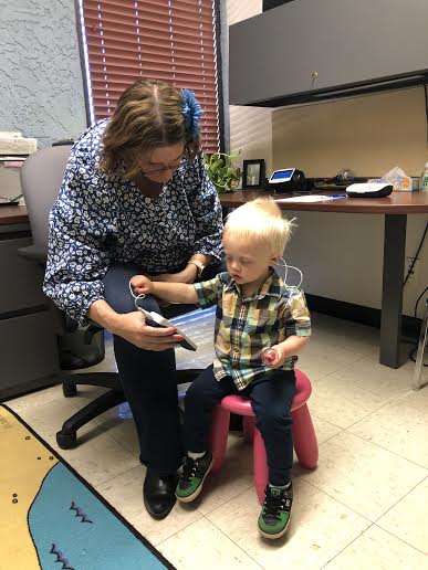 Young boy getting a hearing exam. 