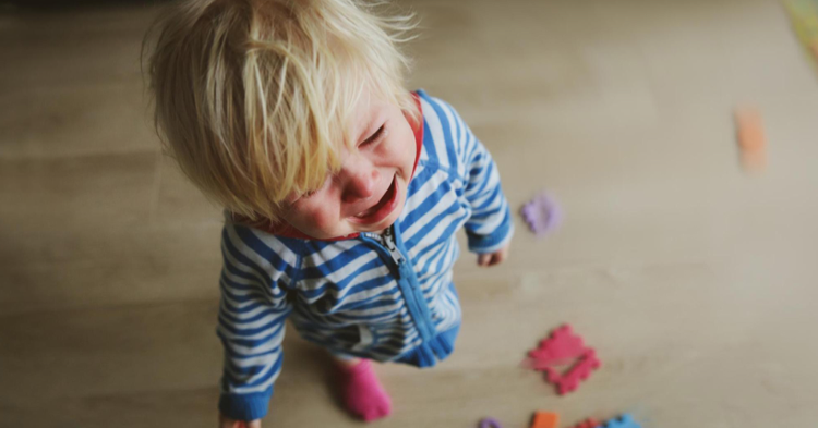 crying toddler standing